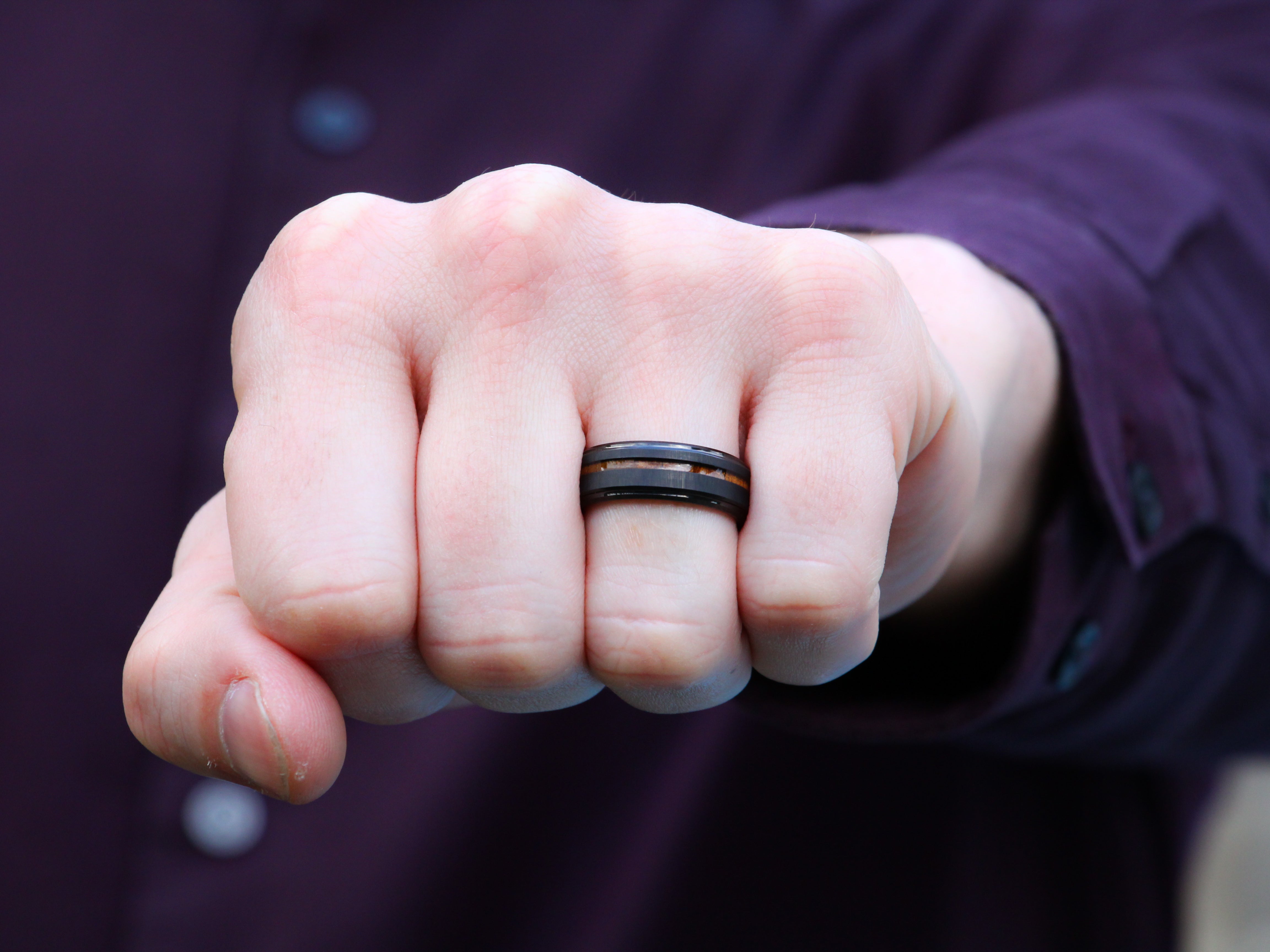 Black Tungsten Band with a Koa Wood Strip worn as a Men's Wedding Ring