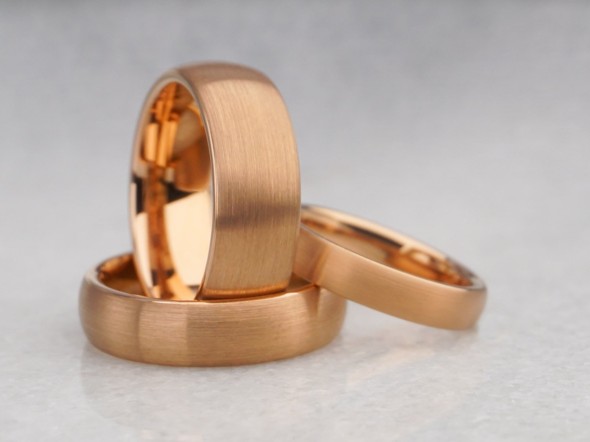 matching set of rose gold plated tungsten rings