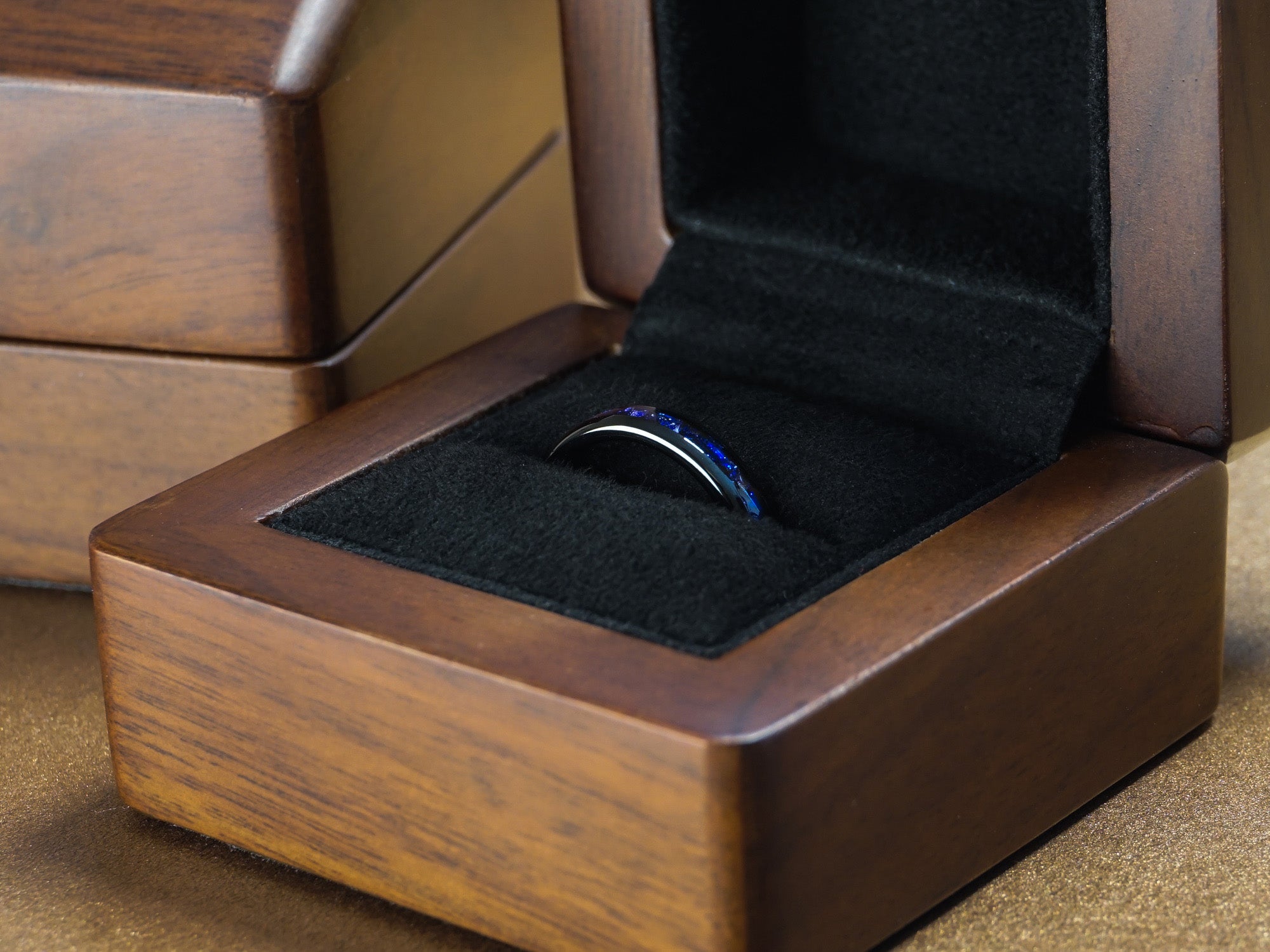 4mm black sapphire tungsten ring in a luxury wood ring box, black polished ring with blue lab sapphire inlay