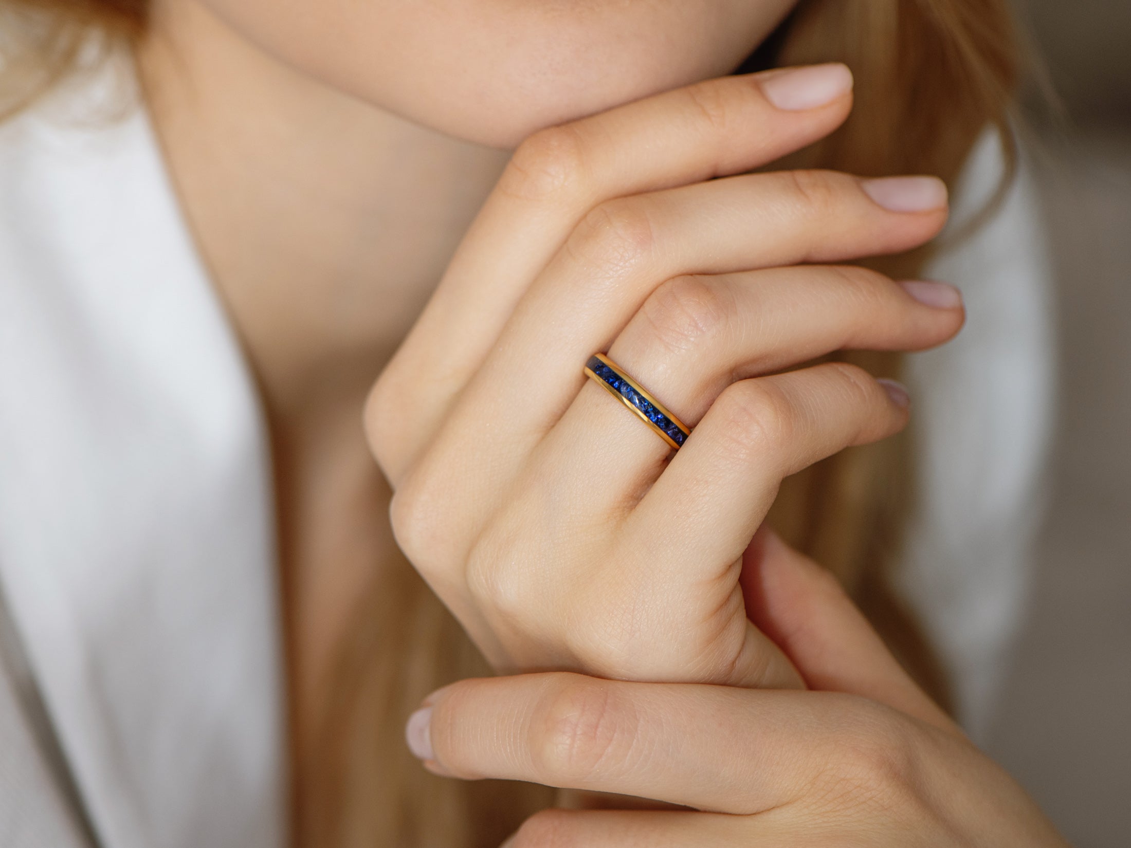 4mm gold tungsten ring with sapphire inlay, womens hand photo