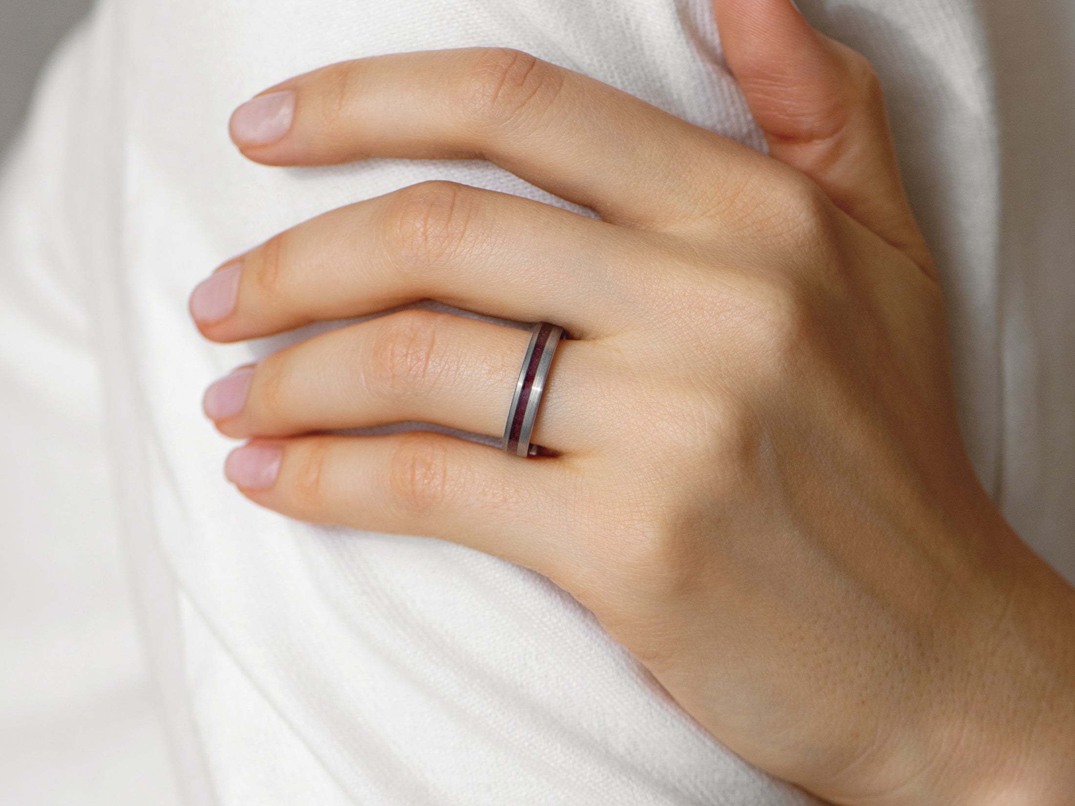 4mm silver tungsten ring with genuine garnet inlay, womens hand photo