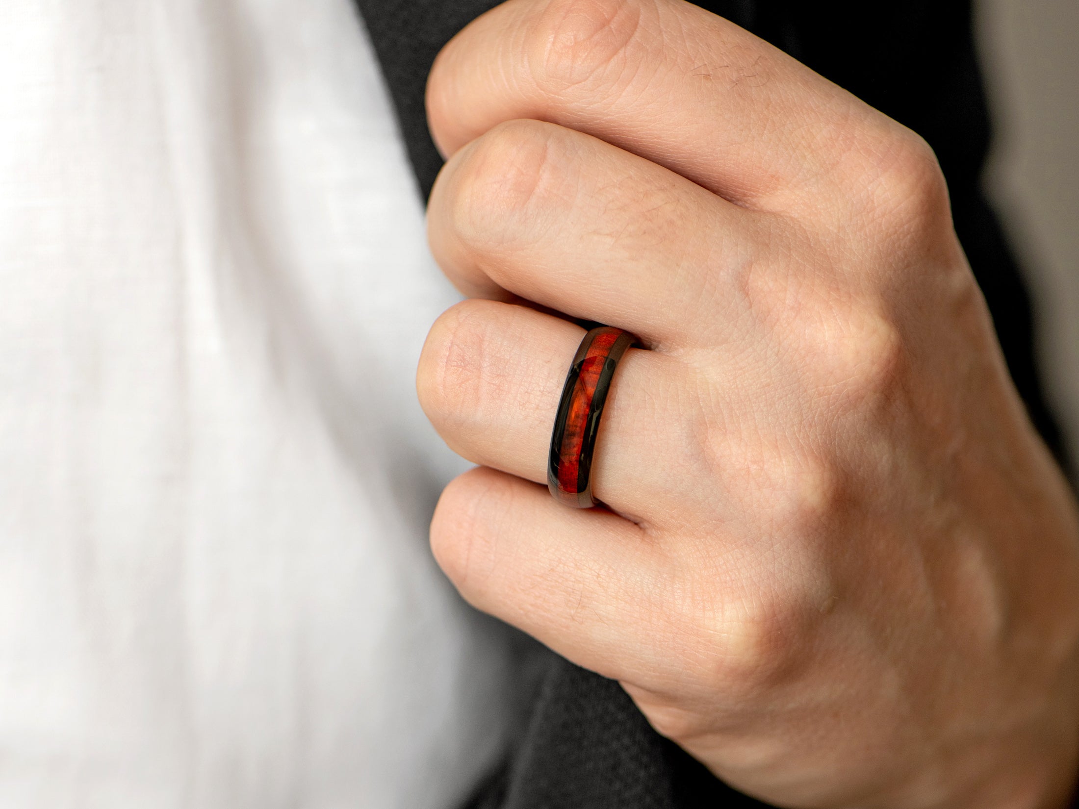 6mm black tungsten ring with redwood inlay, mens hand photo