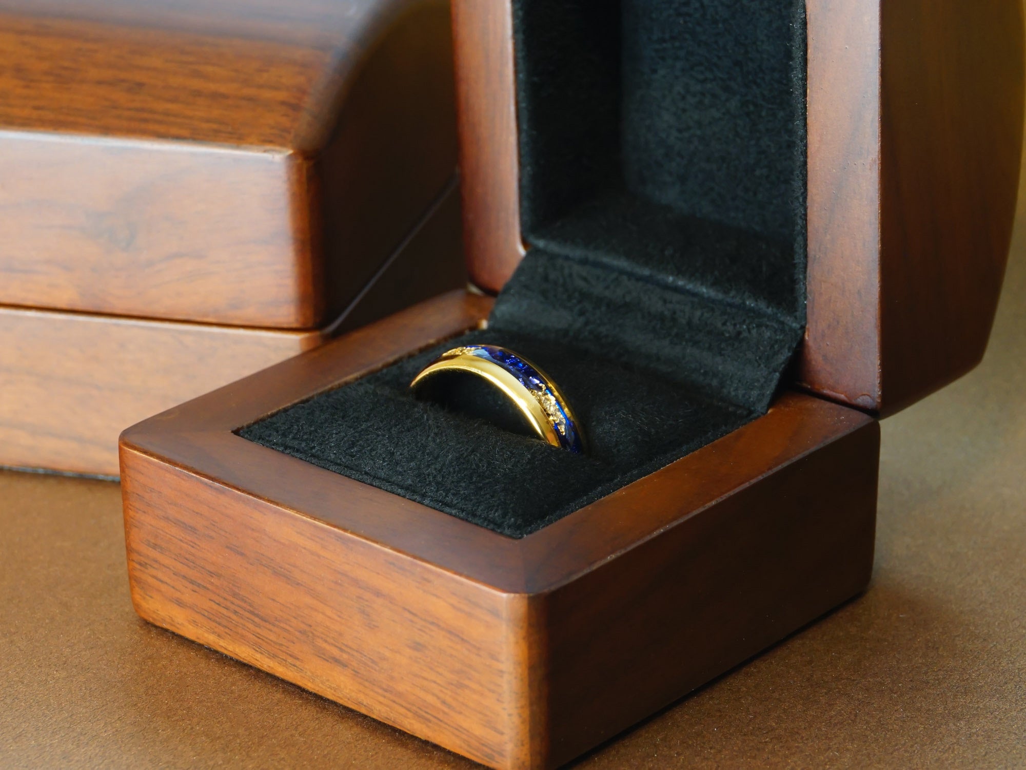 6mm gold sapphire ring in a luxury wood ring box gold plated ring with blue sapphire and gold foil inlay