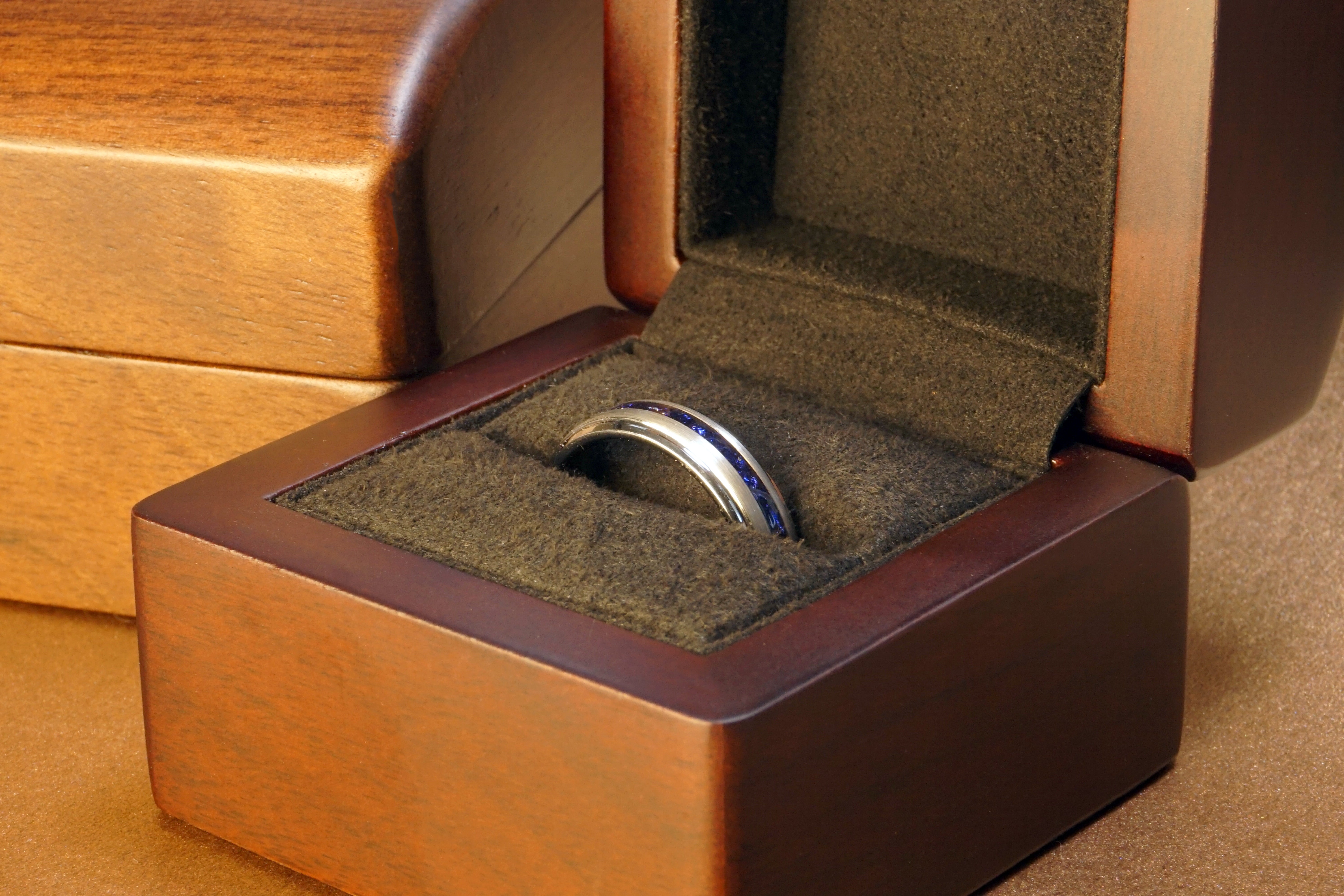 6mm silver sapphire gentlemans band in a luxury wood ring box, stepped brushed tungsten mens ring with blue lab created sapphire strip