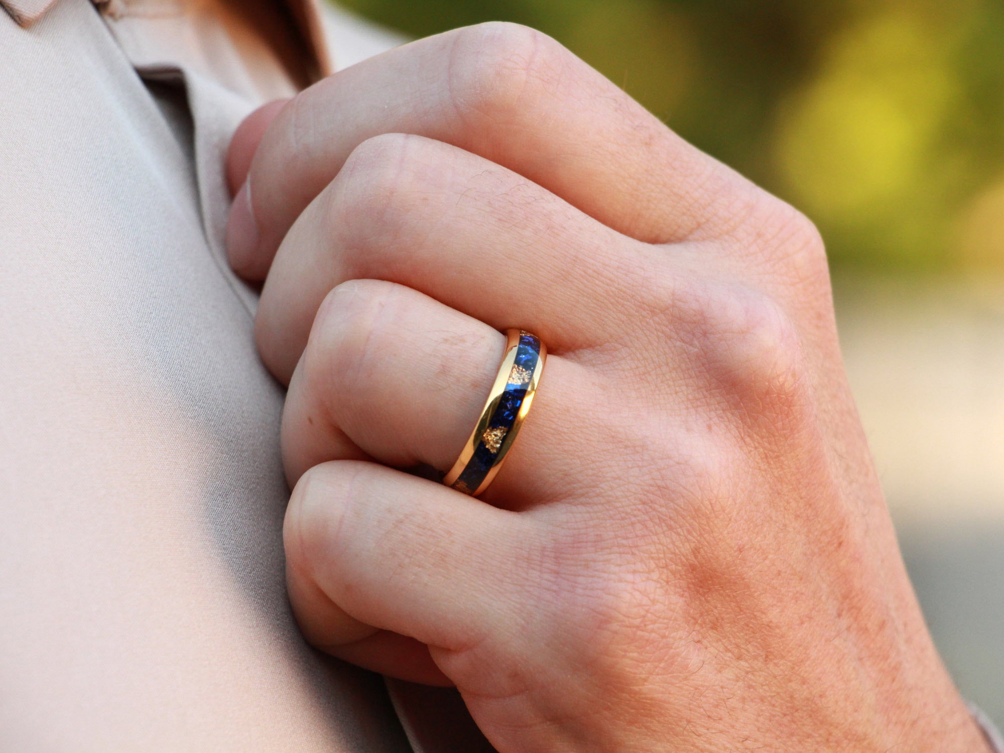 gold sapphire tungsten ring, gold leaf and blue lab created sapphire inlay, 6mm yellow gold wedding band, mens hand photo