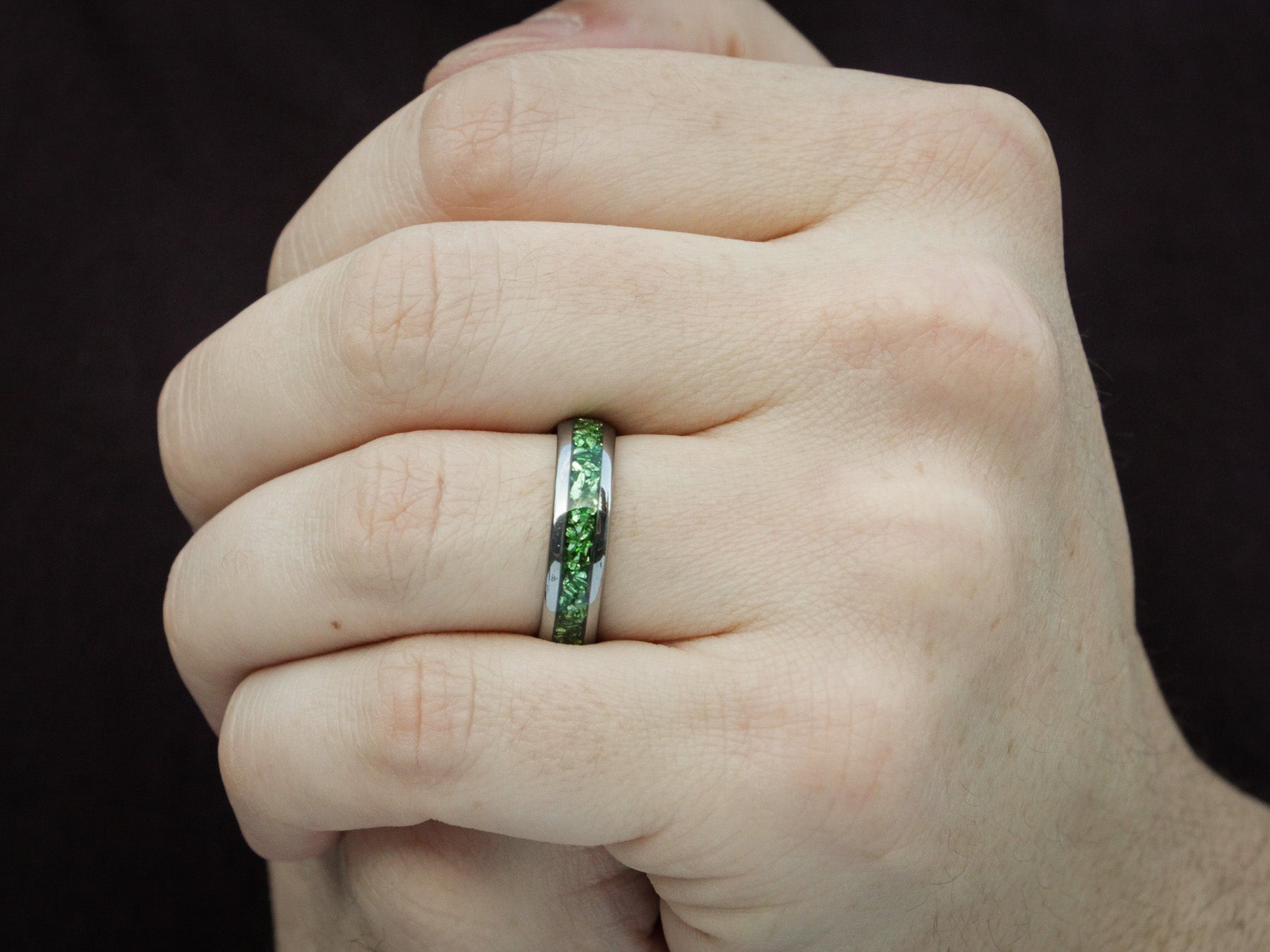 green emerald tunsten ring, lab emerald crushed gemstone inlay, 6mm polished silver wedding band, mens hand photo