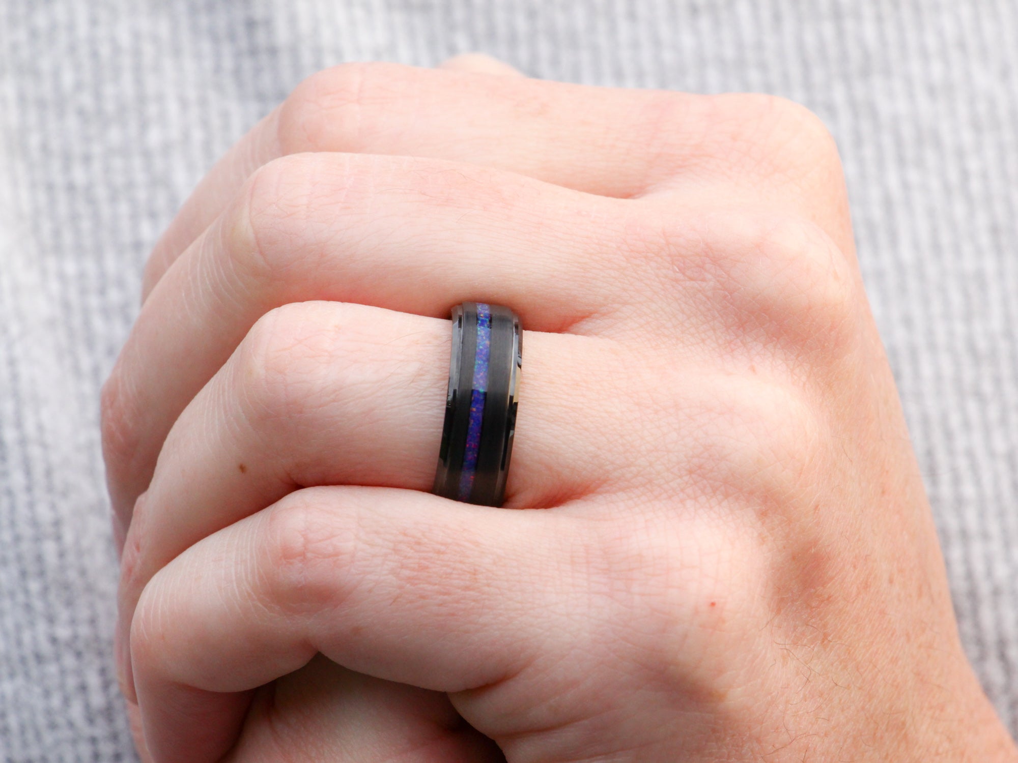 twilight opal tunsten ring, lab grown indigo purple inlay, 8mm polished black wedding band, mens hand photo