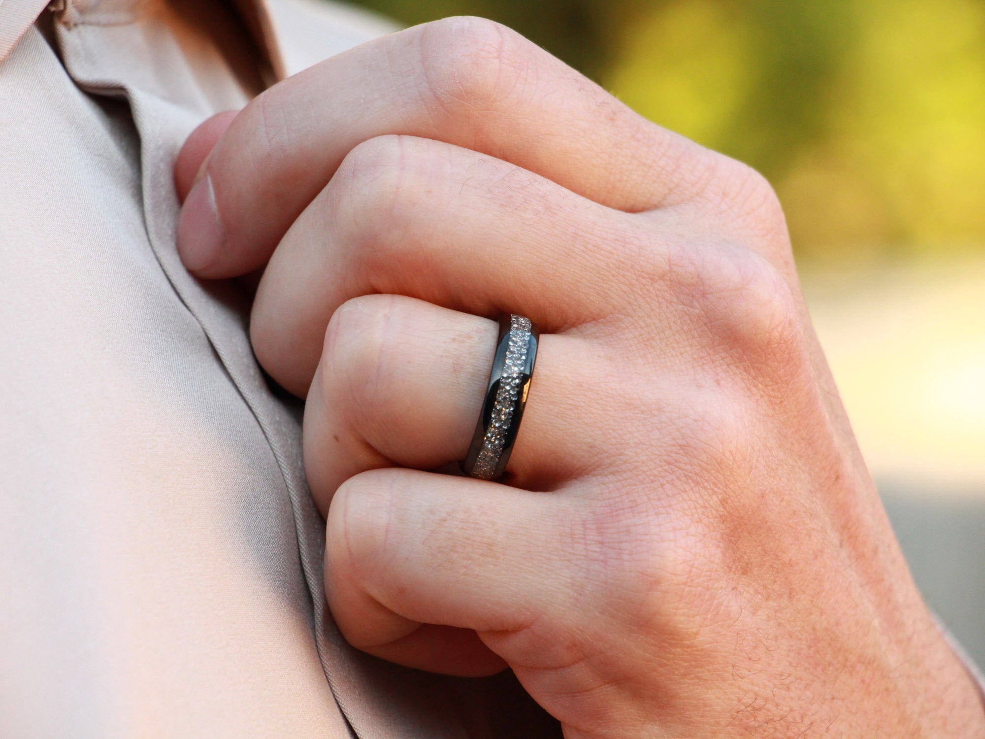 white diamond tungsten ring, lab grown diamond gemstone inlay, 6mm black wedding band, mens hand photo