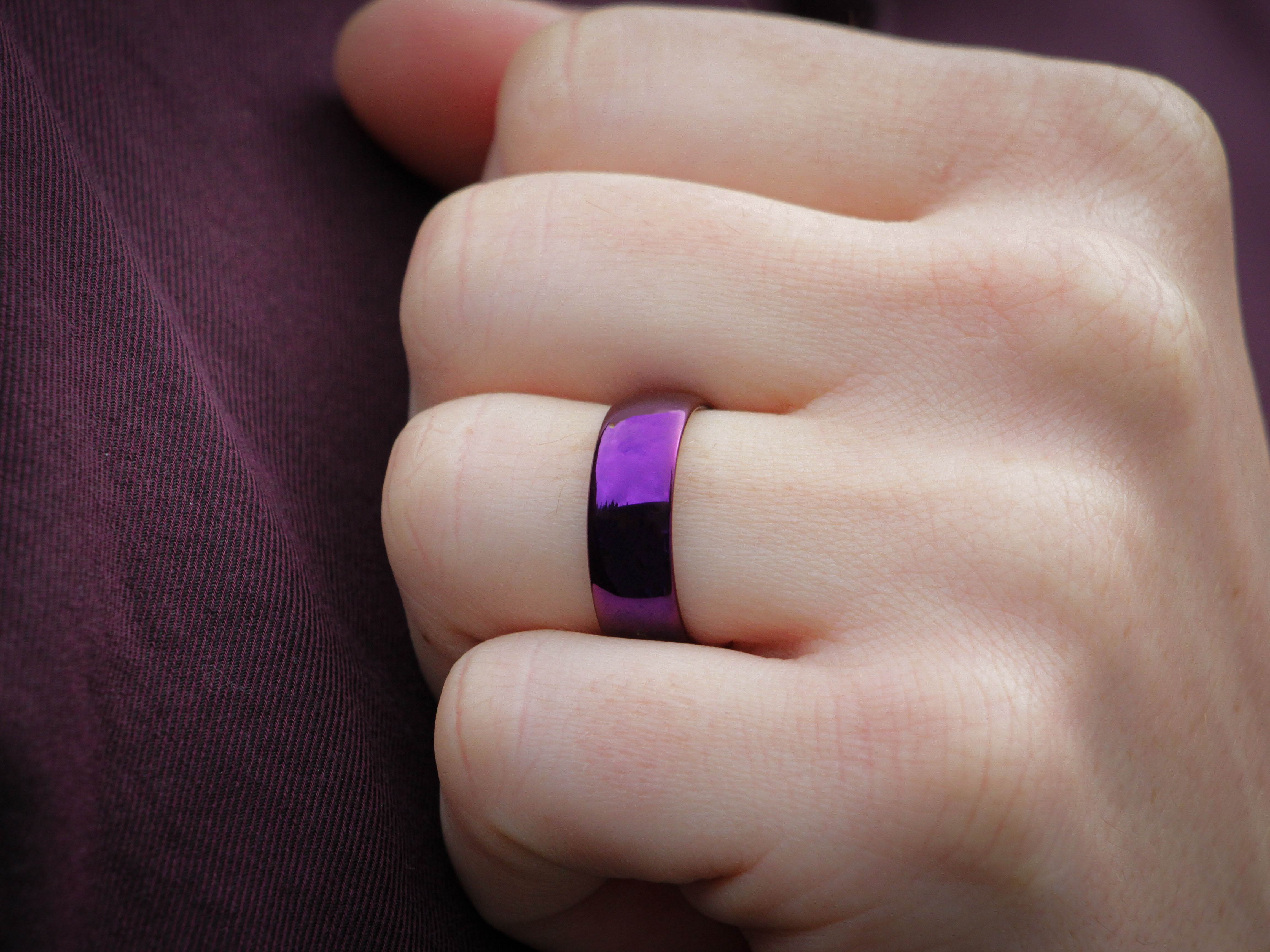 purple polished tungsten ring, mens hand photo, bright fuchsia violet ring